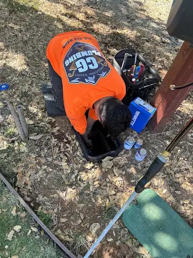 CG Plumbing technician performing outdoor plumbing repair in Sacramento County, California fixing underground pipes and ensuring reliable water flow for residential property.